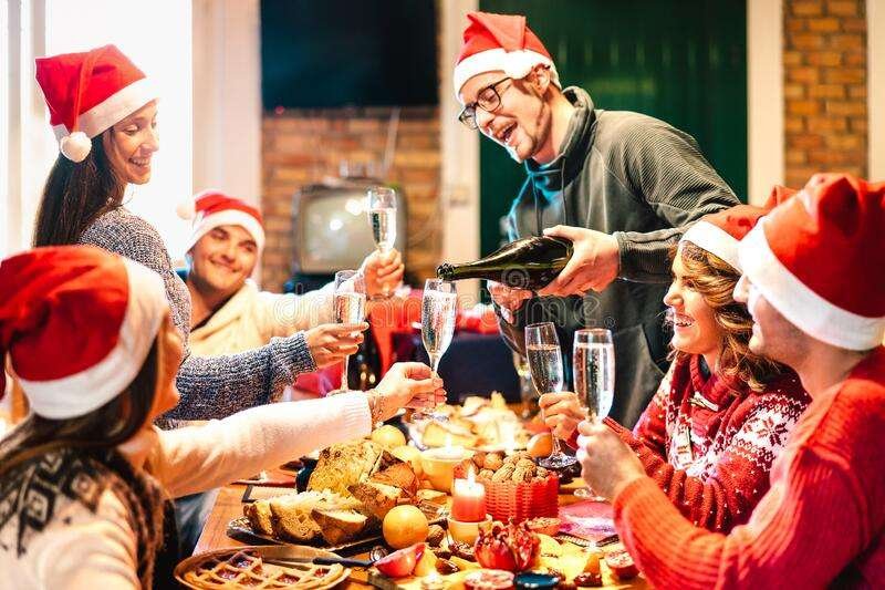 millenial-friends-santa-hats-celebrating-christmas-champagne-sweets-food-log-cabin-winter-holidays-concept-234489779
